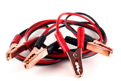 A picture of a car battery jumper cable.